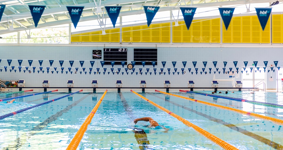 Lone lap swimmer in HBF Arena 50m pool